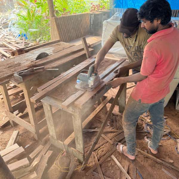 Carpenter working on wooden details for Luma Goa's renewed huts
