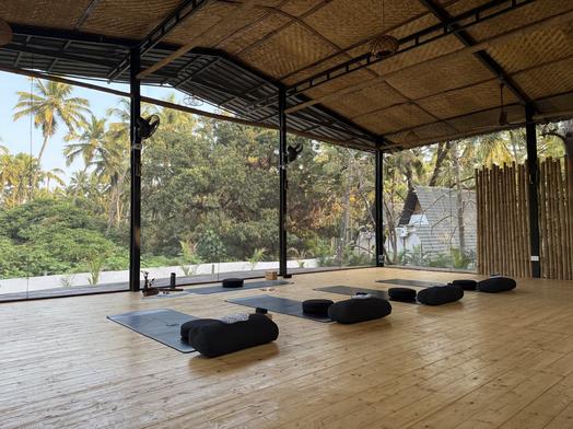 Tropical yoga shala with palm trees